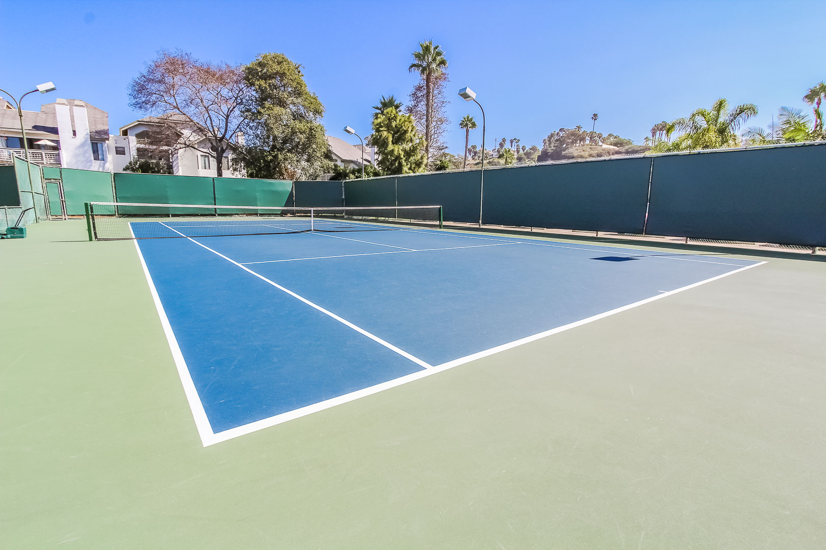 A vibrant tennis court at VRI's Winner Circle Resort in California.